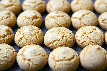 Amaretti cookies as a background.Italian amarettini biscuits close up.Amarettini cookies.Tasty Italian amaretti biscuits.
Selective focus.