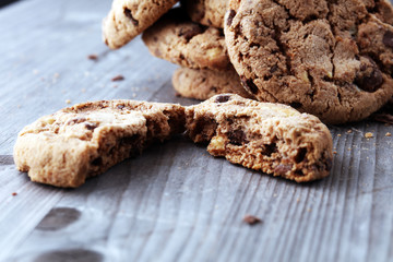 Chocolate cookies on wooden table. Chocolate chip cookies shot.