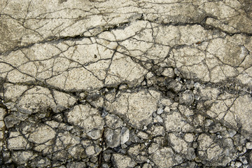 Background and Wallpaper or texture of broken cement road old with damage and crack.