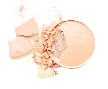 Pink powder cosmetic powder make up crushed on white.