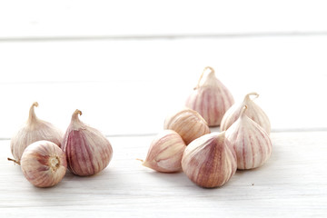 Fresh healthy garlic on white table