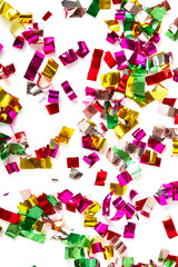 close up of confetti on white background