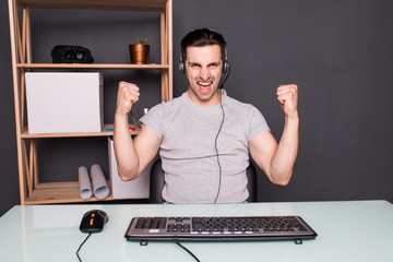 Night play. young gamer in headphones using computer for playing game at home © F8  \ Suport Ukraine