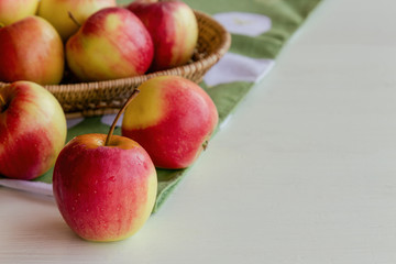 Fresh red fuji apple and in basket put on wood table for background or wallpaper in vintage tone style. Delicious sweet and juicy fuji for goodness cooking or bakery.Fuji apple has origins in Japan.