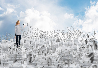 Woman keeping megaphone in hand.