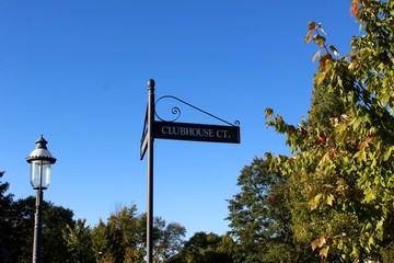 A view of the street sign with the blue sky background. 
