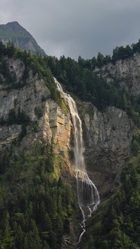 Majestic waterfall Oltschibachfall. Waterfall near Meiringen. Swiss Alps.