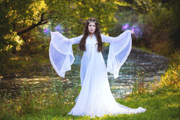 Sorcerer practicing magic in the forest
