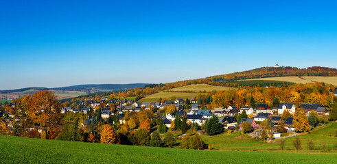 Panorama view Seiffen in Autumn . Saxony Germany ore mountains with blue sky