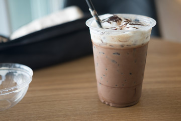 Iced coffee mocha cup on wooden table