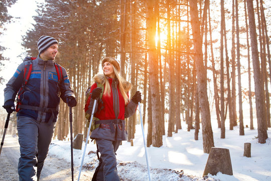Love couple hiking on winter