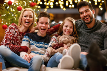 Obraz na płótnie Canvas Cheerful family together for Christmas