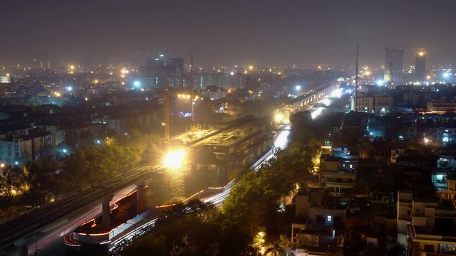 Cinemagraph or motion photo of traffic in noida delhi gurgaon region. This shows the huge amount of traffic that goes through the major streets of the city. Under construction metro rails are also