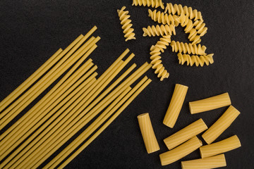 Selection of Raw Uncooked Italian Style Pasta Spaghetti Rigatoni and Fusilli