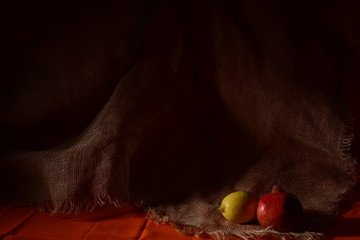 still life lemon and pomegranate on the background of linen material