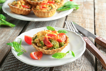 Delicious crispy tart with broccoli on plate