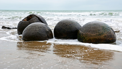 Moeraki Boulders on New Zealand beach of Otago coast