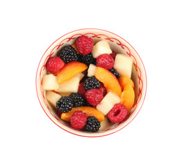 Bowl with delicious fruit salad on white background