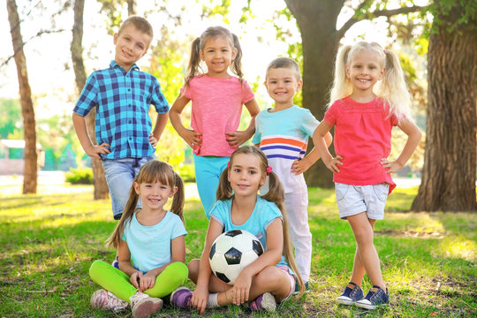 Cute little children with ball in park