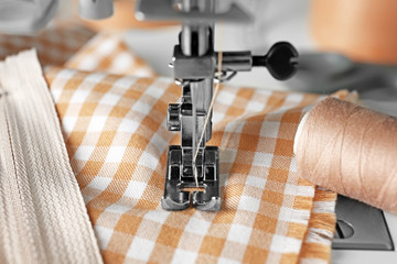 Sewing machine on table, closeup