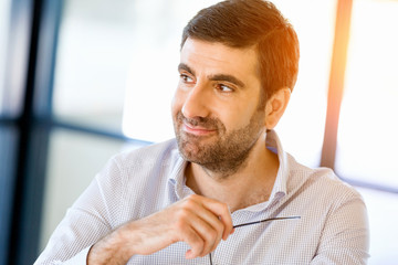 Pensive businessman at office