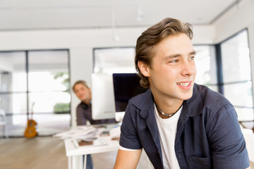Young man in casual in office