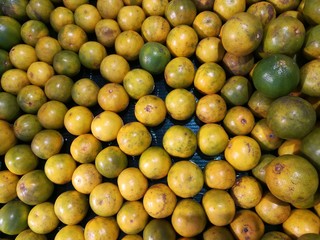Citrus fruit, tangerine background. Fresh fruit at fruit market. Freshness and lively feeling concept.