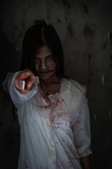 Ghost woman or Zombie holding point knife