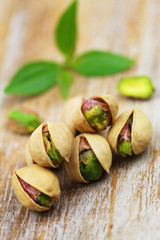 Nutritious pistachio nuts on rustic wooden surface
