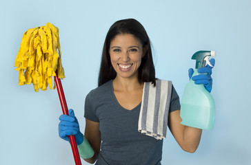  attractive hispanic woman happy proud as home or hotel maid cleaning and housekeeping holding soap...