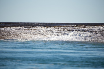 Montgomery Reef, one of the natural wonders of the world. Rising 4 meters above the sea on a low tide.