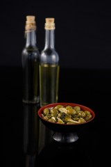 Close-up of marinated olives with olive oil and balsamic vinegar