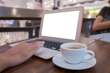 Fototapeta premium Close up of business man hand working on blank screen laptop computer in cafe blur or blurred soft focus