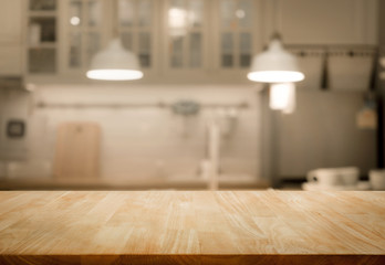 Wood table top on blur kitchen room background .For montage product display or key visual layout. key visual layout.
