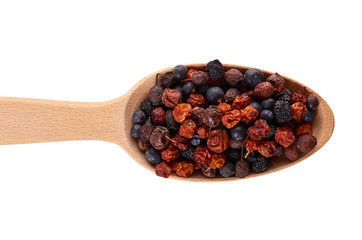 healthy dried berries in wooden spoon isolated on white background