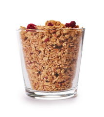 homemade granola with dried fruits in glass cup isolated on white background