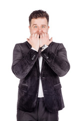 business man biting his nails fingers freaking out. human emotion expression and lifestyle concept. image on a white studio background..