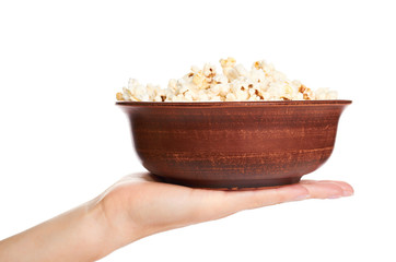 fresh pop corn in hand isolated on white background