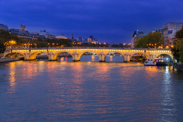 Pont Neuf and river Seine waters at night, Paris, France