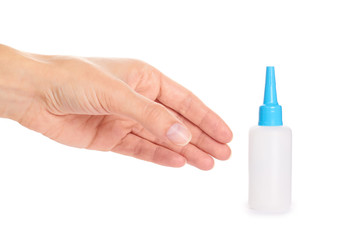 White glue container in hand isolated on a white background