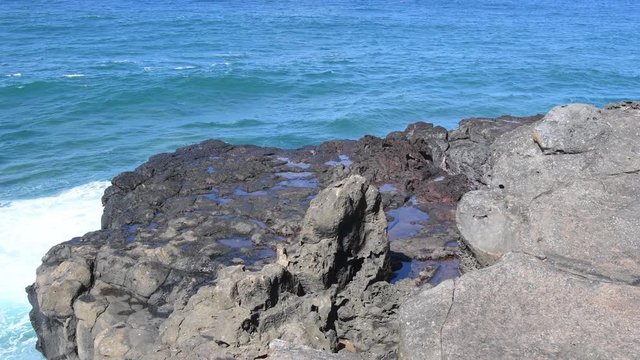 La Roche qui Pleure in Mauritius creates a  illusion as surging waves recede on the cliff. 