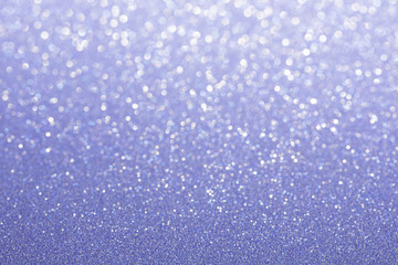 Blue (purple) glitter background. Sparkle texture. Abstract background blurred for New Years or...