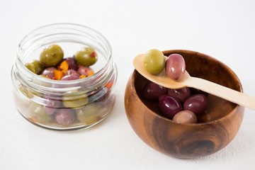 Marinated olives in bowl and jar