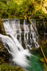 Waterfall at the Vintgar gorge, beauty of nature, with river Radovna flowing through, near Bled, Slovenia.