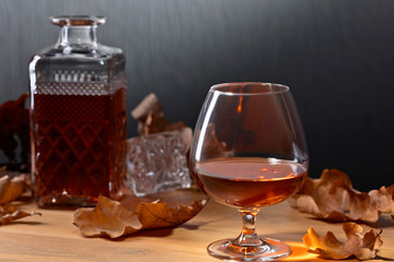 Brandy and dried up oak leaves .