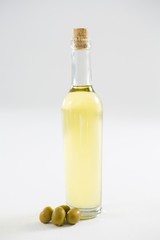 Green olive oil in bottle