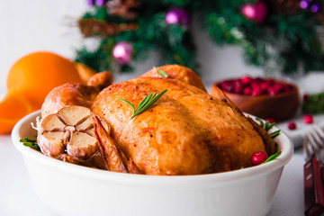 Christmas roasted chicken with cranberries, rosemary and garlic.