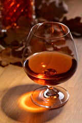 Brandy and dried up oak leaves .