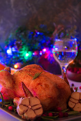 Christmas roasted chicken with cranberries, rosemary and garlic.