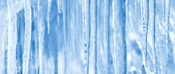 Natural winter bright background of shiny icicles